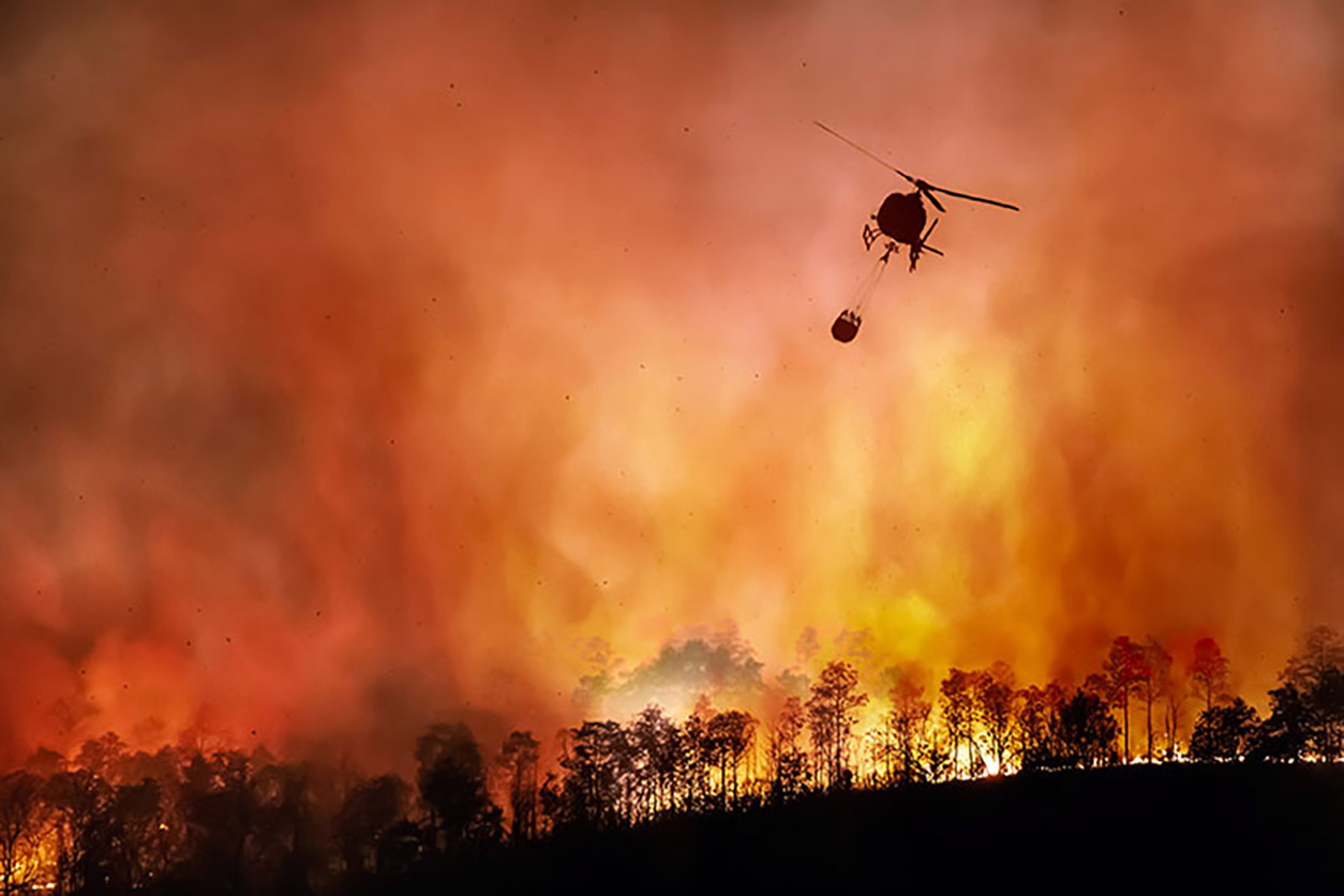Wildfire, helicopter above